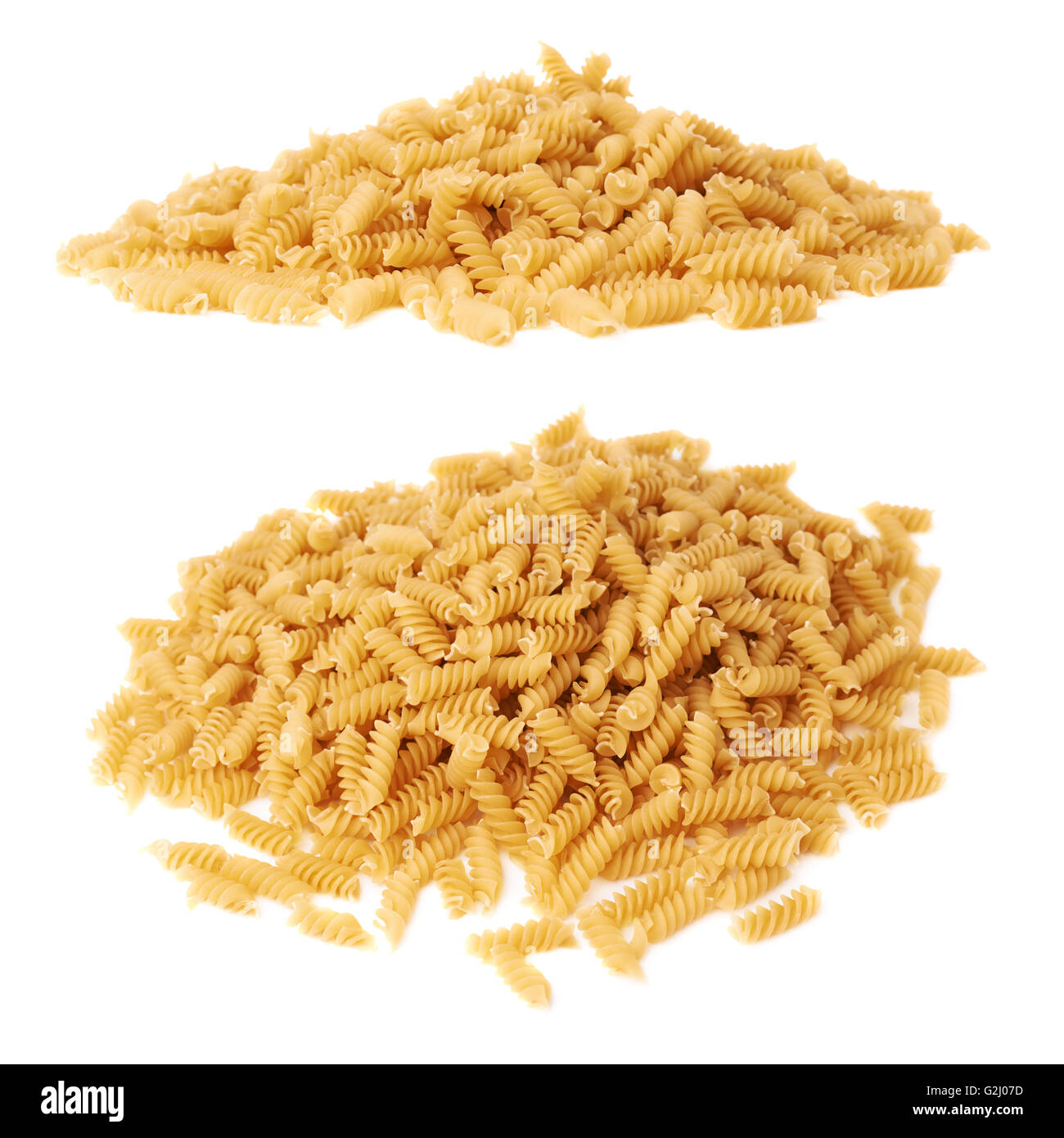 Pile of dry rotini pasta over isolated white background Stock Photo Alamy