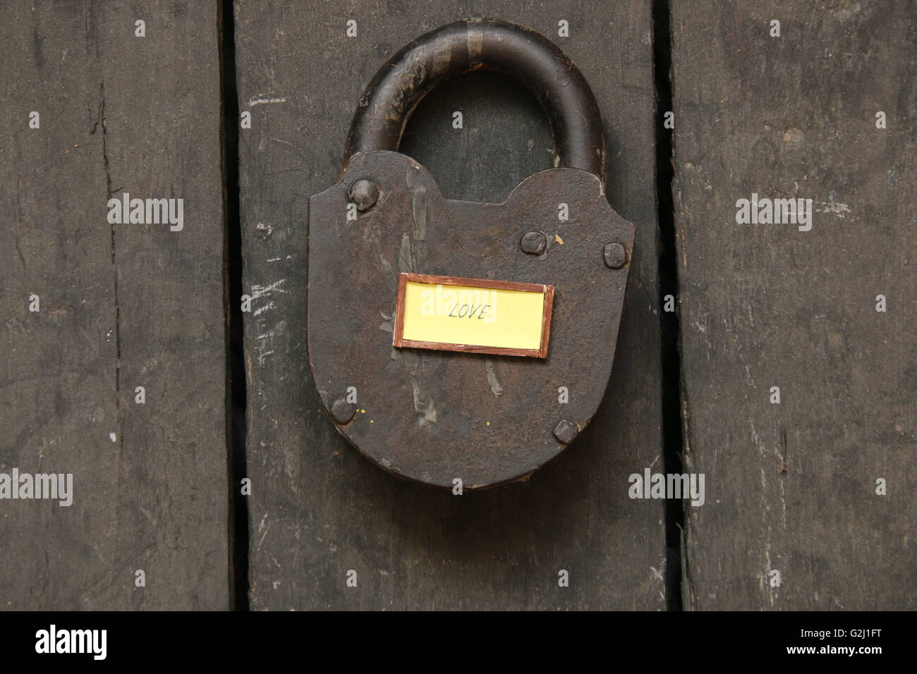 love text and old padlock - valentine card. Stock Photo