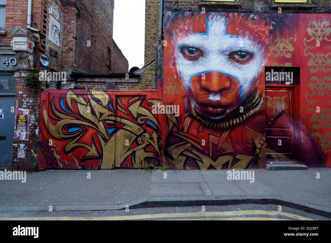 Hanbury Street London colourful red wall art mural on the side of a building. Stock Photo