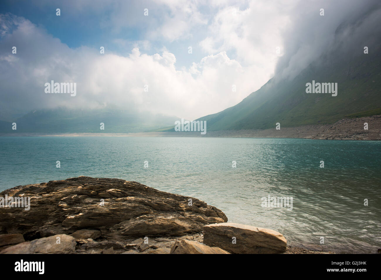 Mountain Lake Against Cloudy Sky, Col du Mont Cenis, Val Cenis Vanoise, France Stock Photo