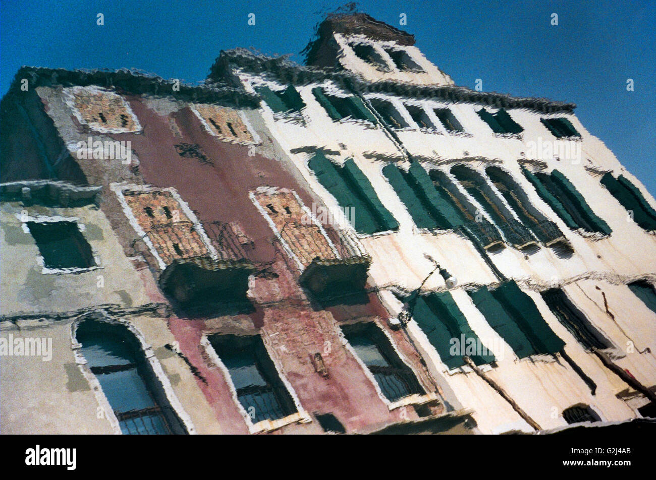 Painterly Reflection of Buildings in Water, Venice Italy Stock Photo