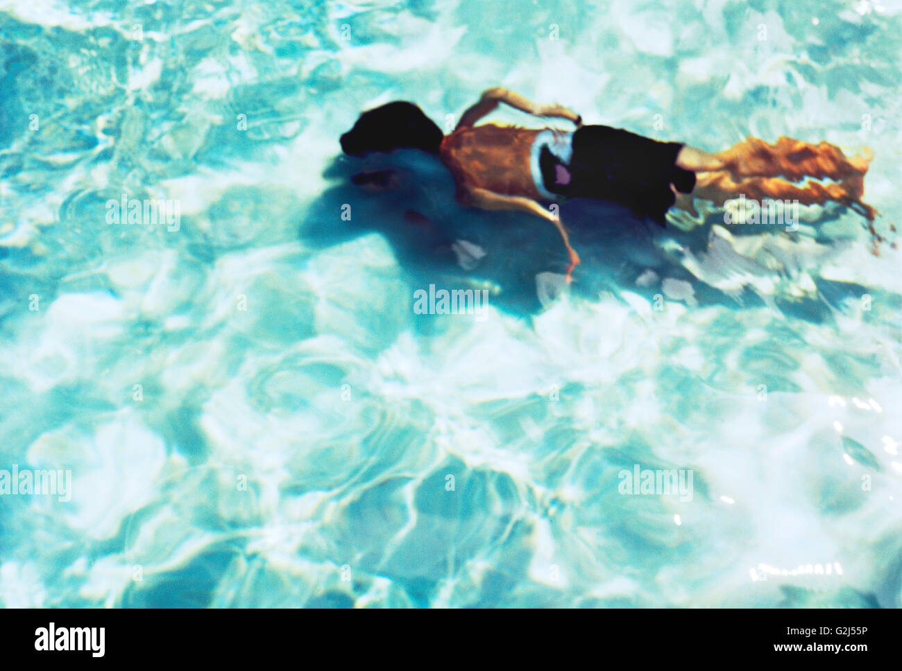 Child Underwater in Swimming Pool Stock Photo