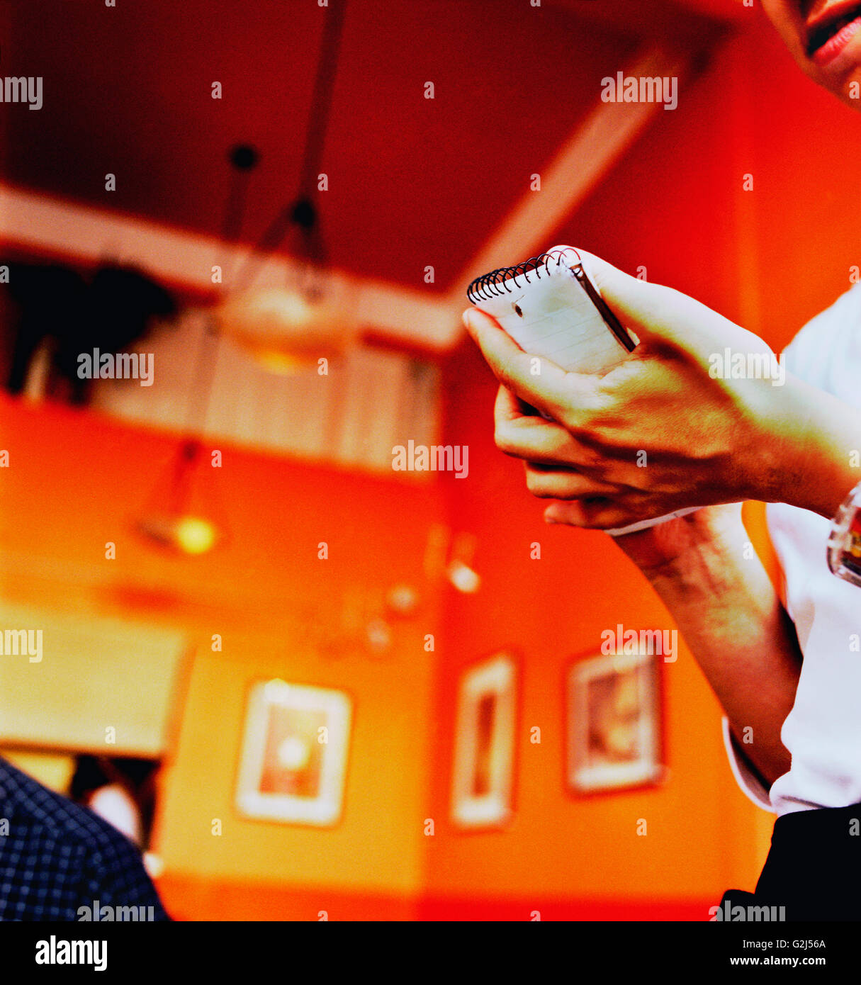 Waiter with Pad Taking Order Stock Photo