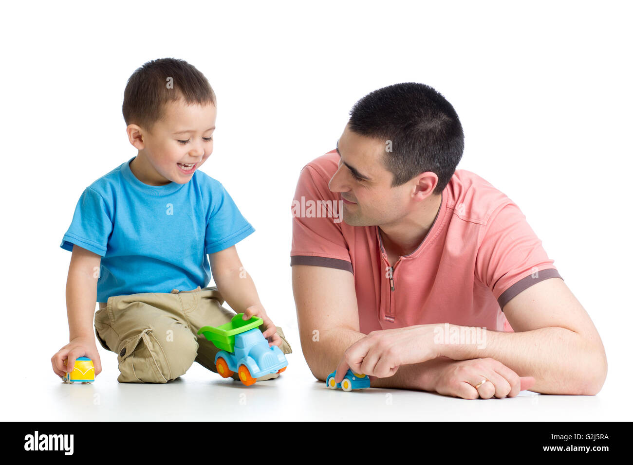 Daddy with little boy playing with toy cars Stock Photo