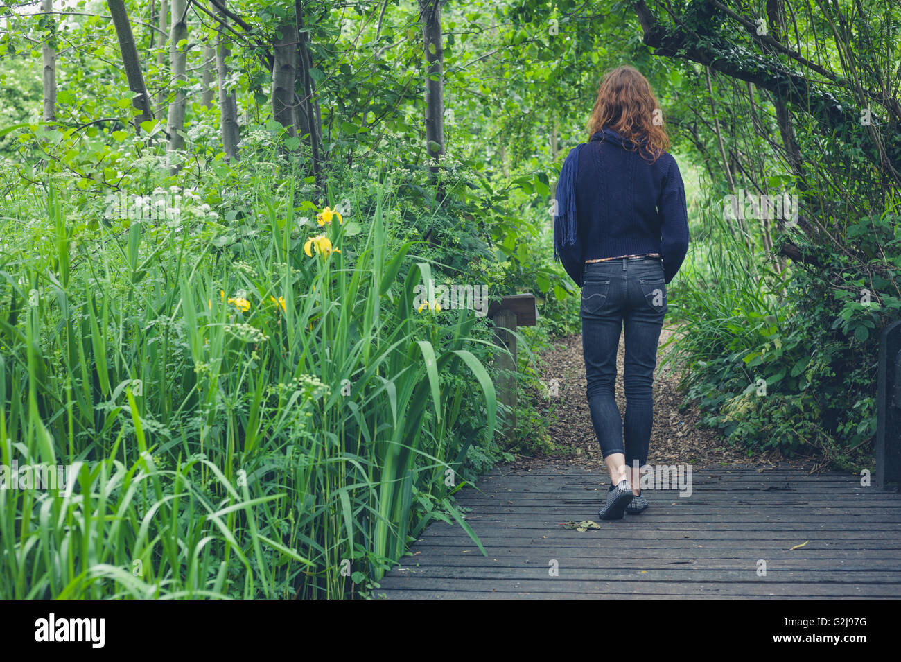 Woman walking on a trail in nature hi-res stock photography and images ...