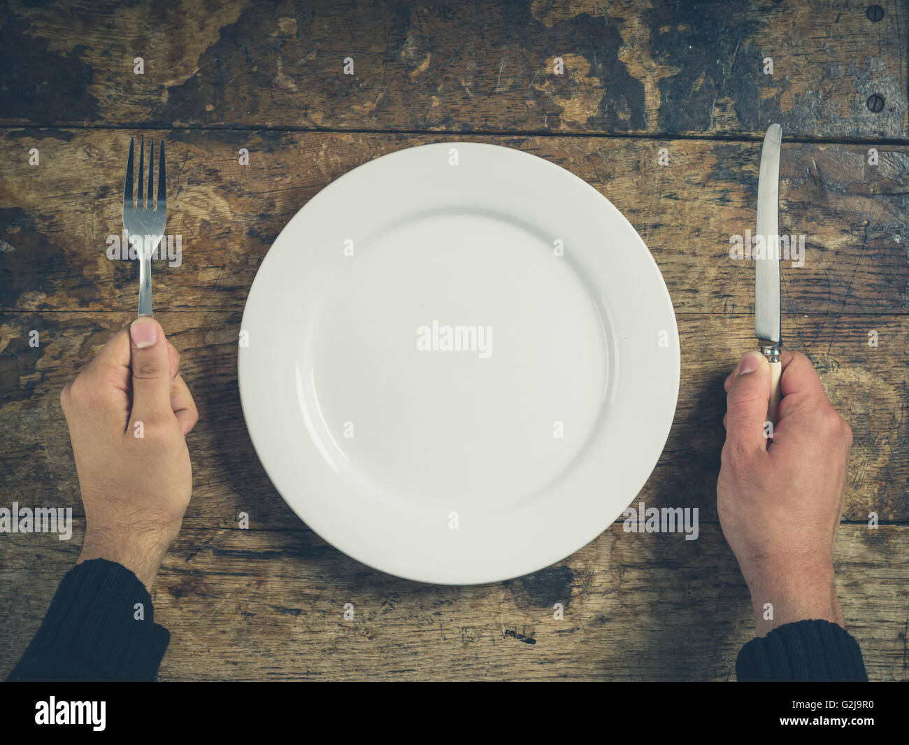 Man holding knife and fork hi-res stock photography and images - Alamy