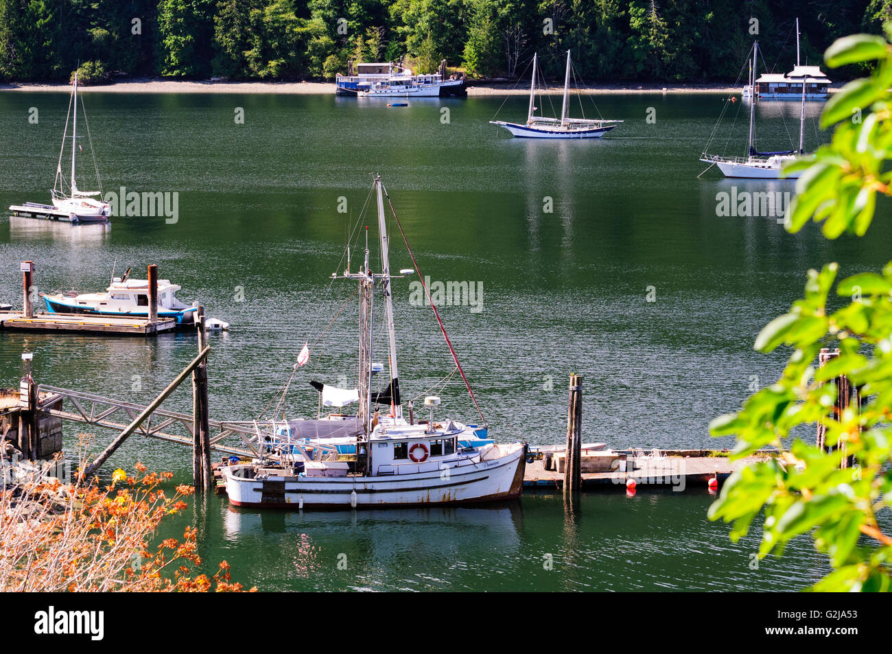 Fishing vessels, boats and sailboats in Burgoyne Bay on Salt Spring Island in British Columbia Stock Photo