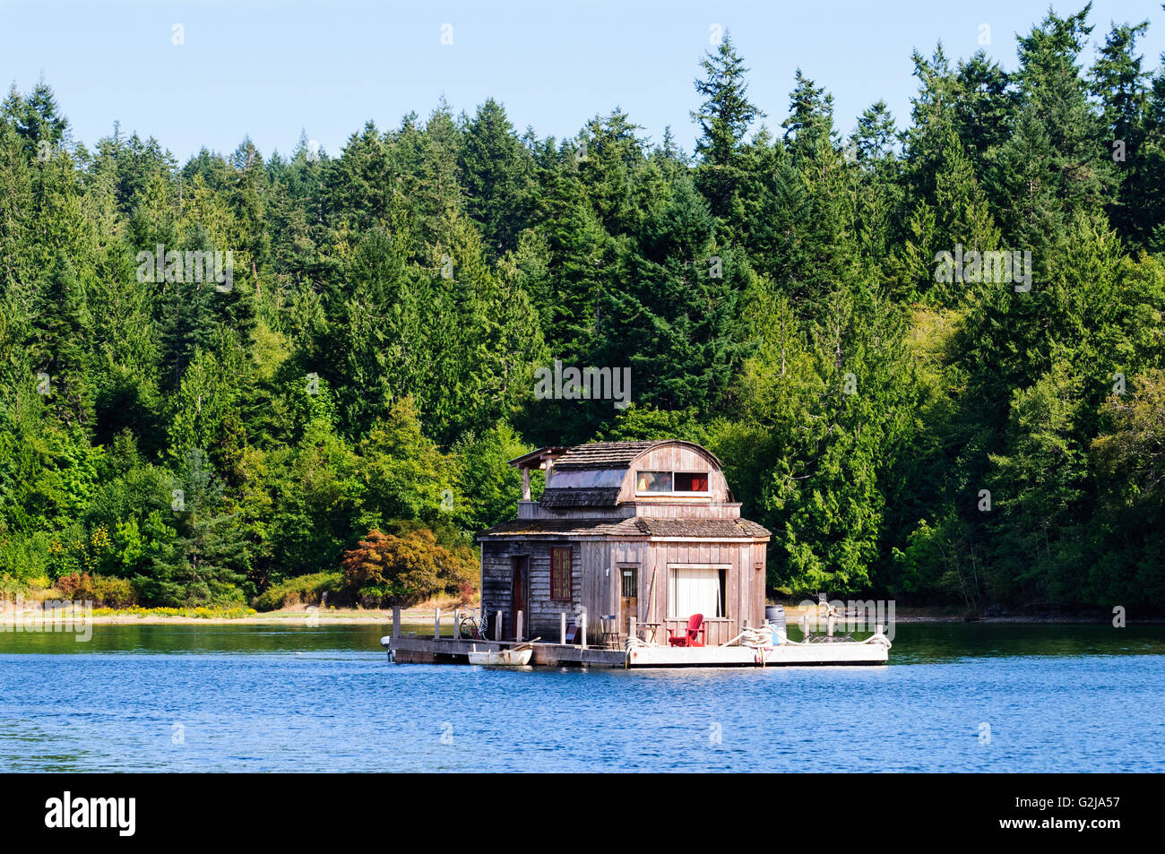 A float home anchored in Burgoyne Bay in Salt Spring Island, British Columbia. Stock Photo
