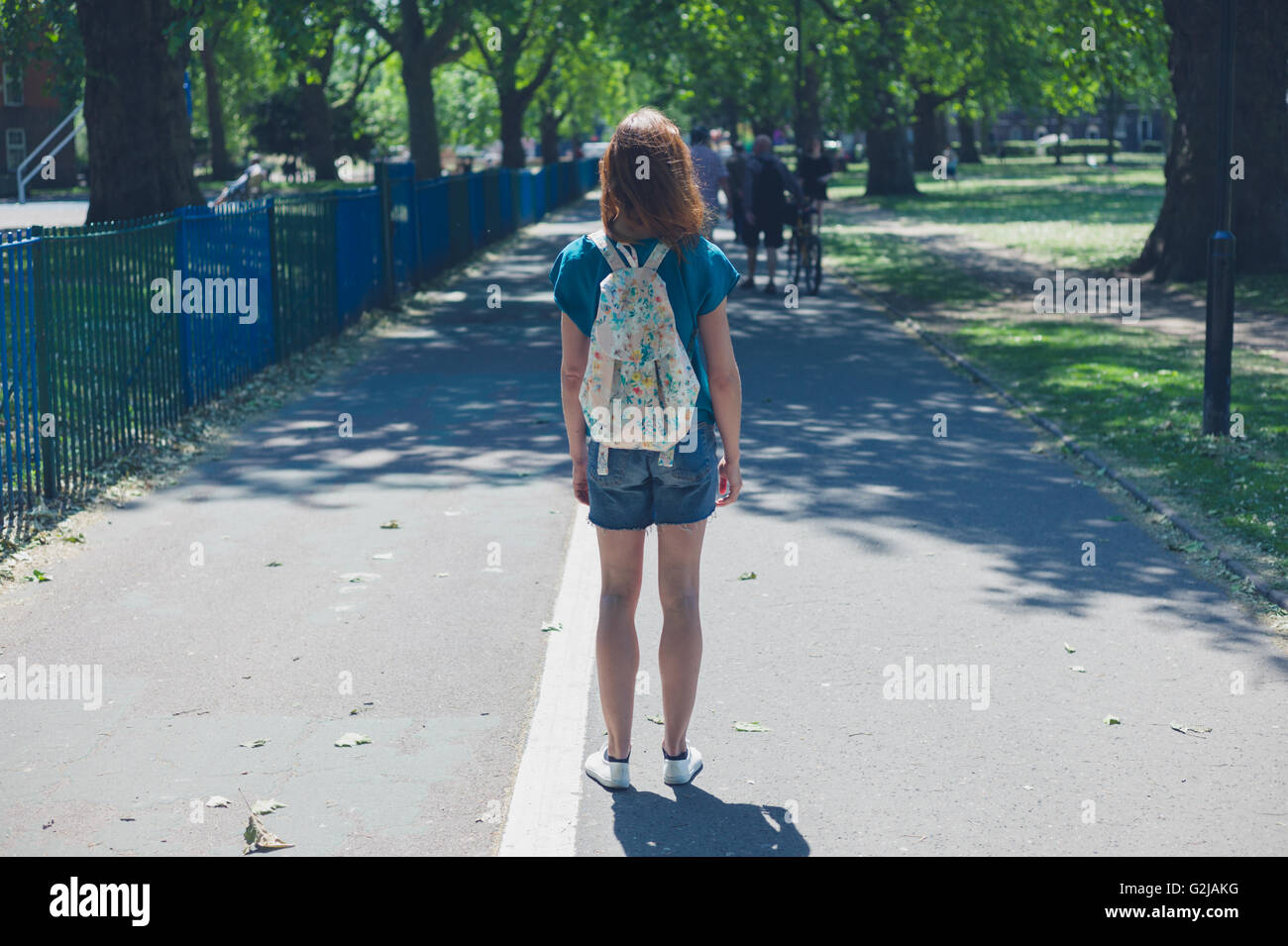 Woman wearing a backpack hi-res stock photography and images - Alamy