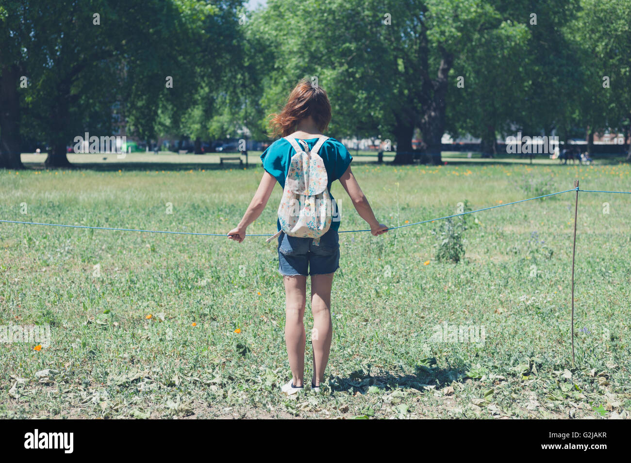 Young woman walking in meadow hi-res stock photography and images - Alamy