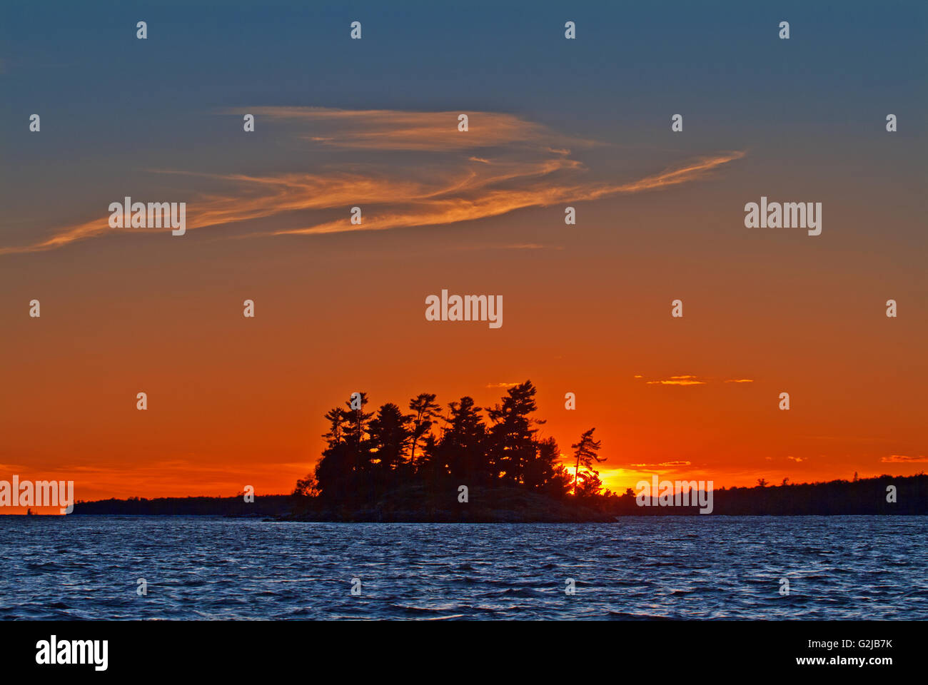 Island on Lake of the Woods at sunset, Morson, Ontario, Canada Stock Photo