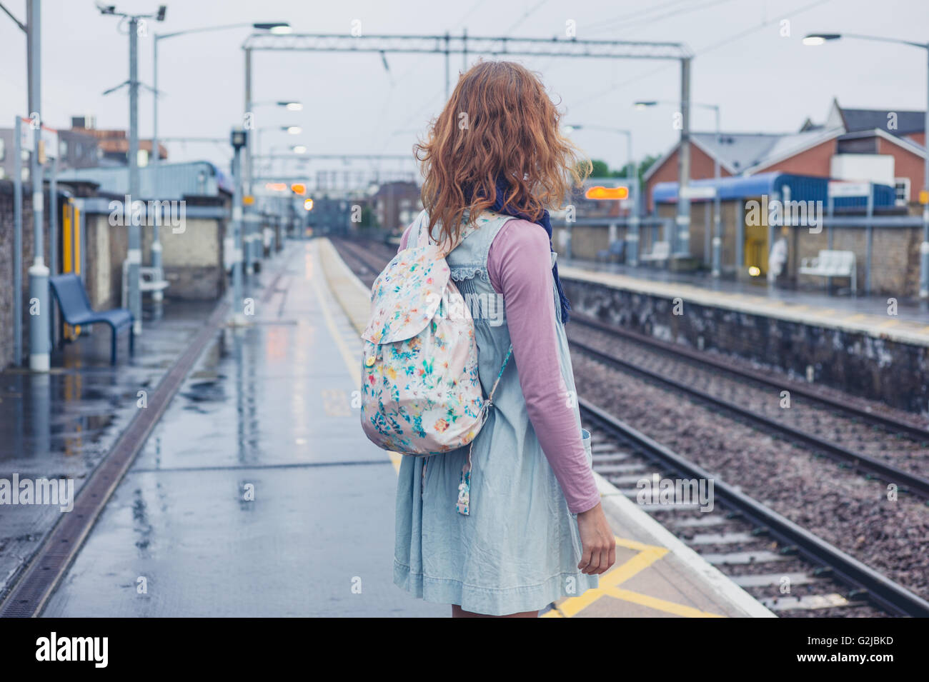 Woman train platform hi-res stock photography and images - Alamy