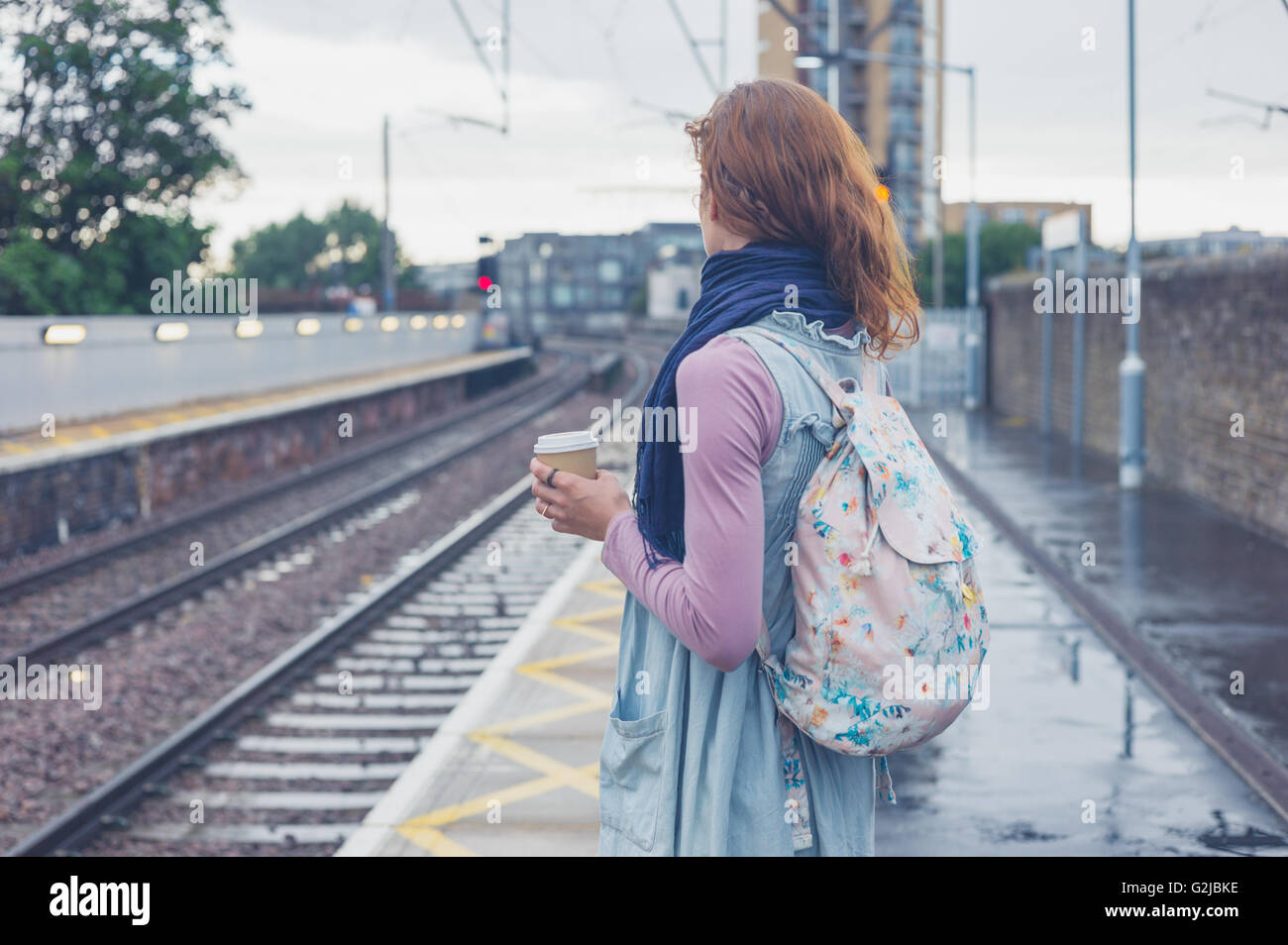 Woman train platform hi-res stock photography and images - Alamy