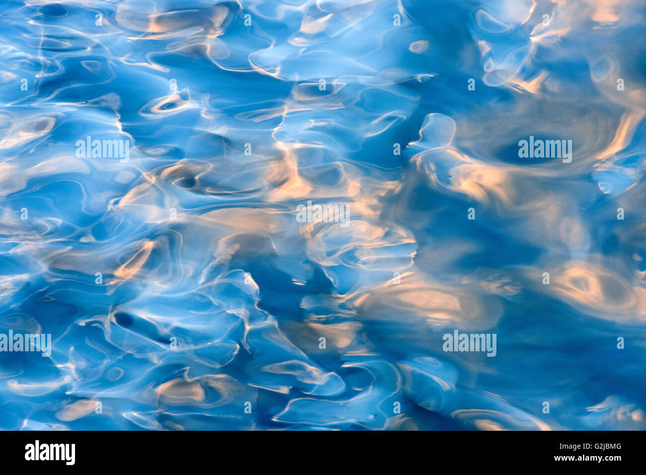 Abstract of moving water on Lake of Bays at sunset, Dorset, Ontario, Canada Stock Photo
