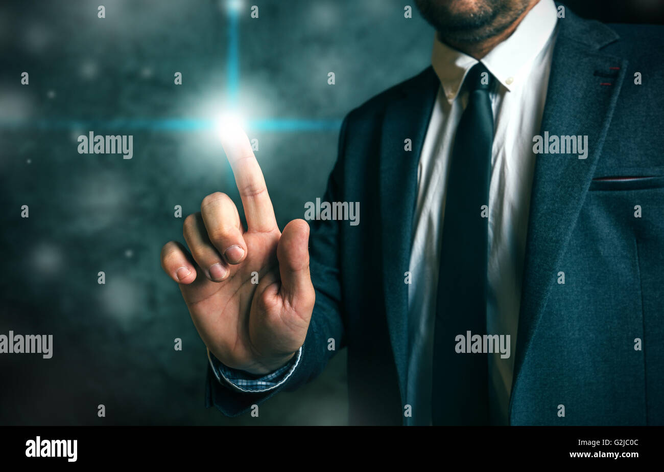 Businessman pushing virtual screen interface button, concept of modern futuristic technology in service of business Stock Photo