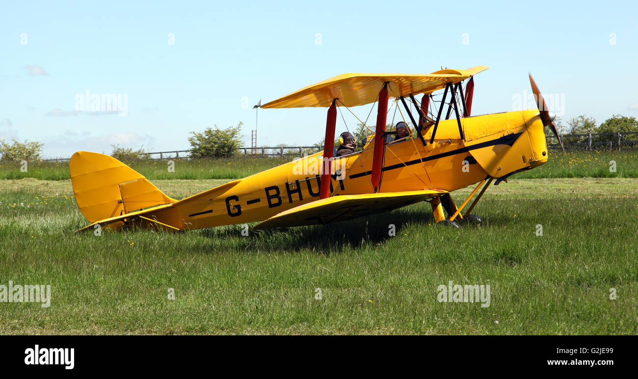 a yellow Tiger Moth aircraft at an airfield in Yorkshire, UK Stock Photo