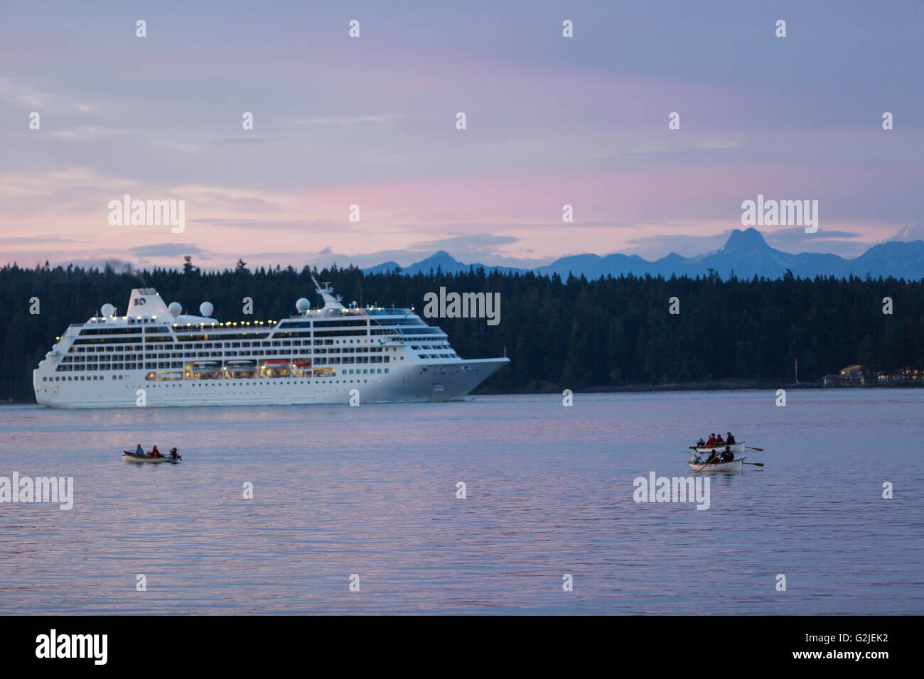 Anglers row in Tyee Pool Salmon while a Princess Line Cruiseship transits waters sharing Discovery Passage them  Discovery Stock Photo