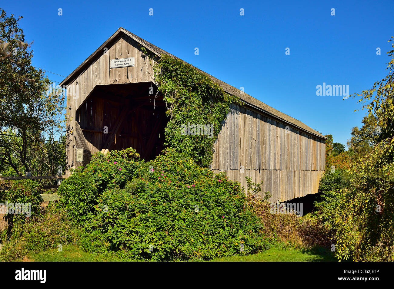 A horizontal view of a covered bridge built in 1908 to cross a section of river near Smith Creek