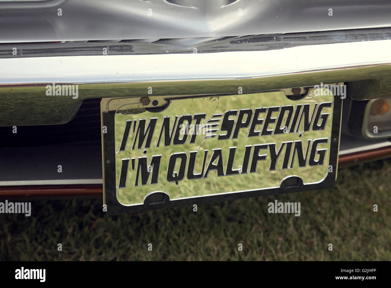 I'm not speeding I'm qualifying sign on a car Stock Photo