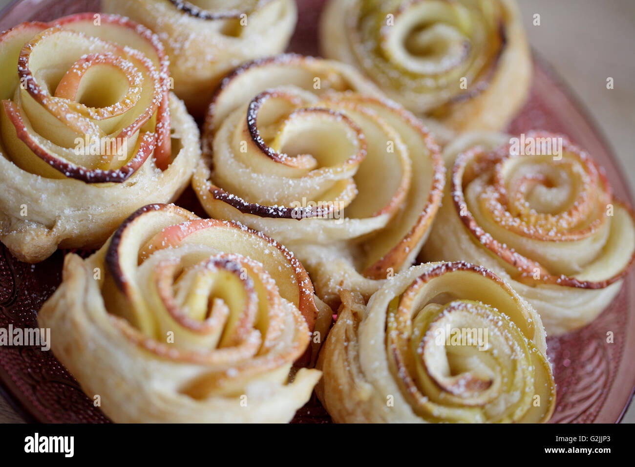 Sweet puff pastry roses with powdered sugar Stock Photo Alamy