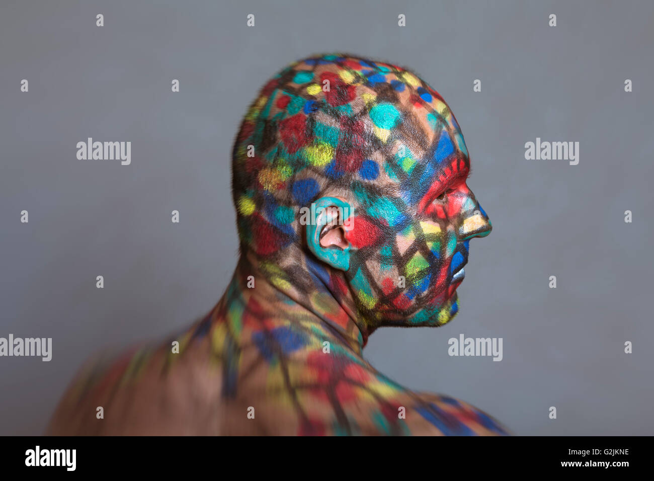 Superhero profile portrait, colorful body art with tilt shift and motion blur effect. Stock Photo