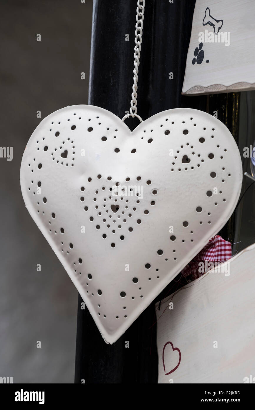 Decorative white metal heart ornament on a chain Stock Photo
