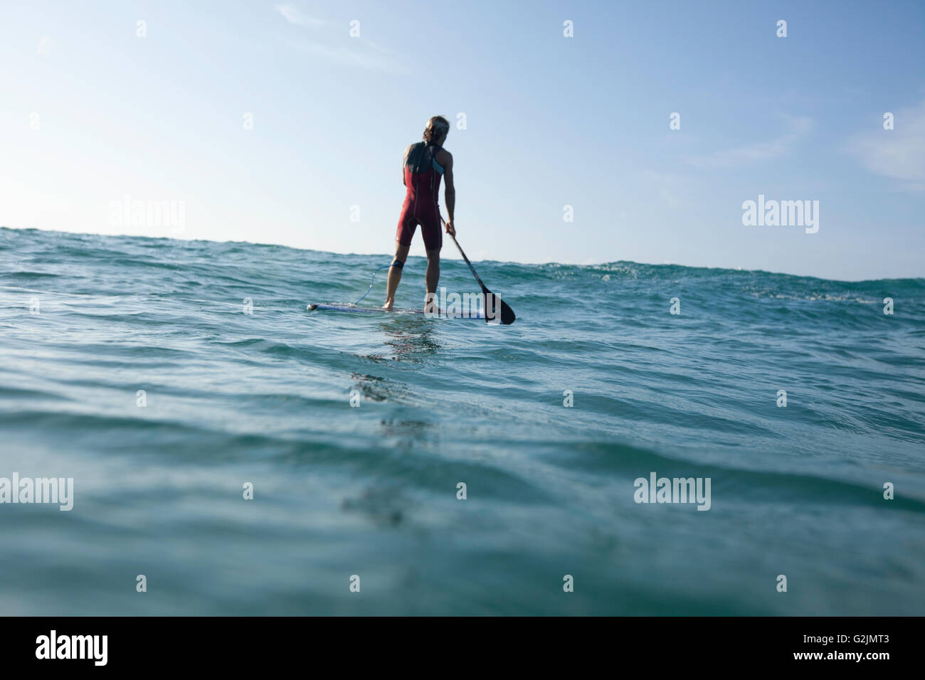 Davide Giardini stand up paddle boarding, surfing off of Diamond Head