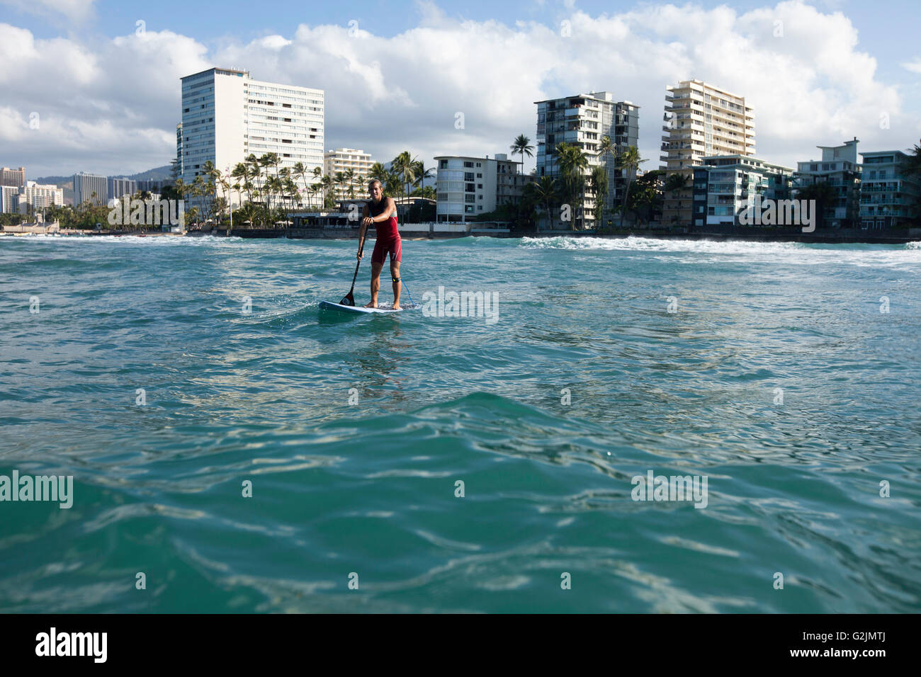 Davide Giardini stand up paddle boarding, surfing off of Diamond Head