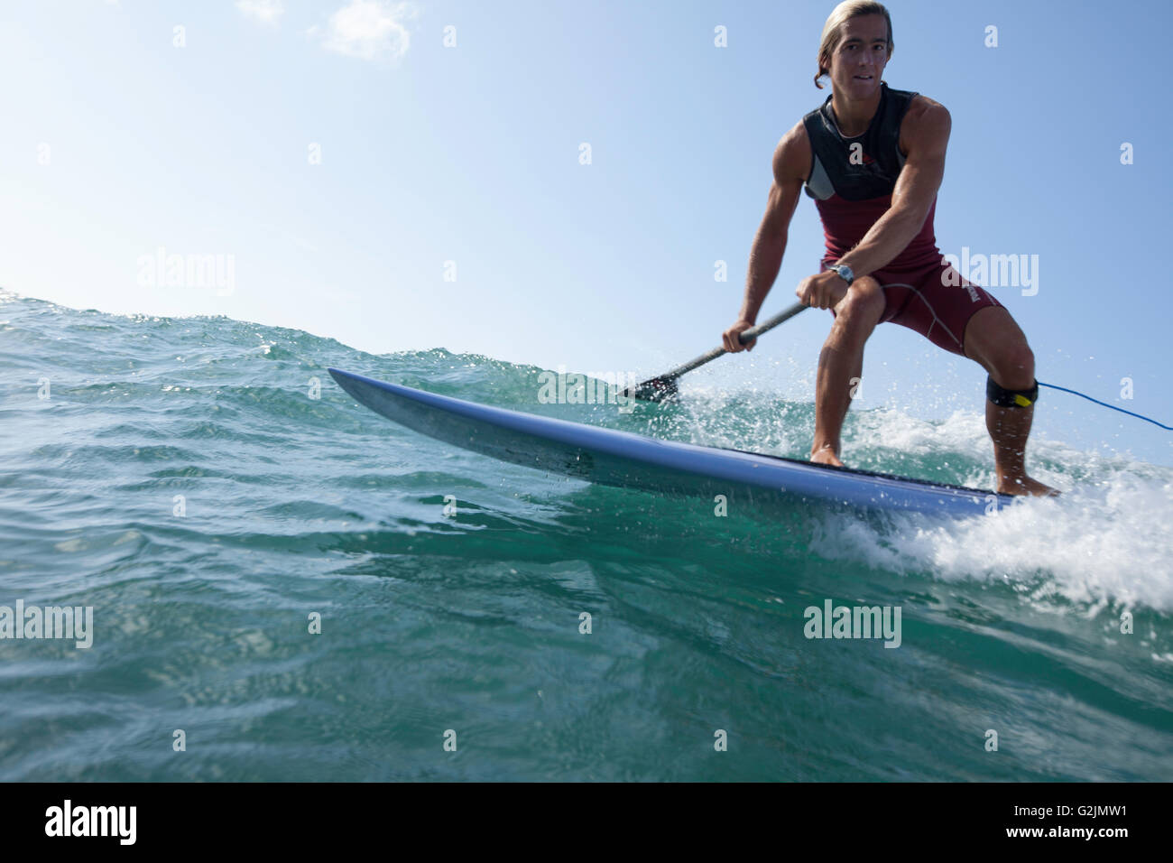 Davide Giardini stand up paddle boarding, surfing off of Diamond Head