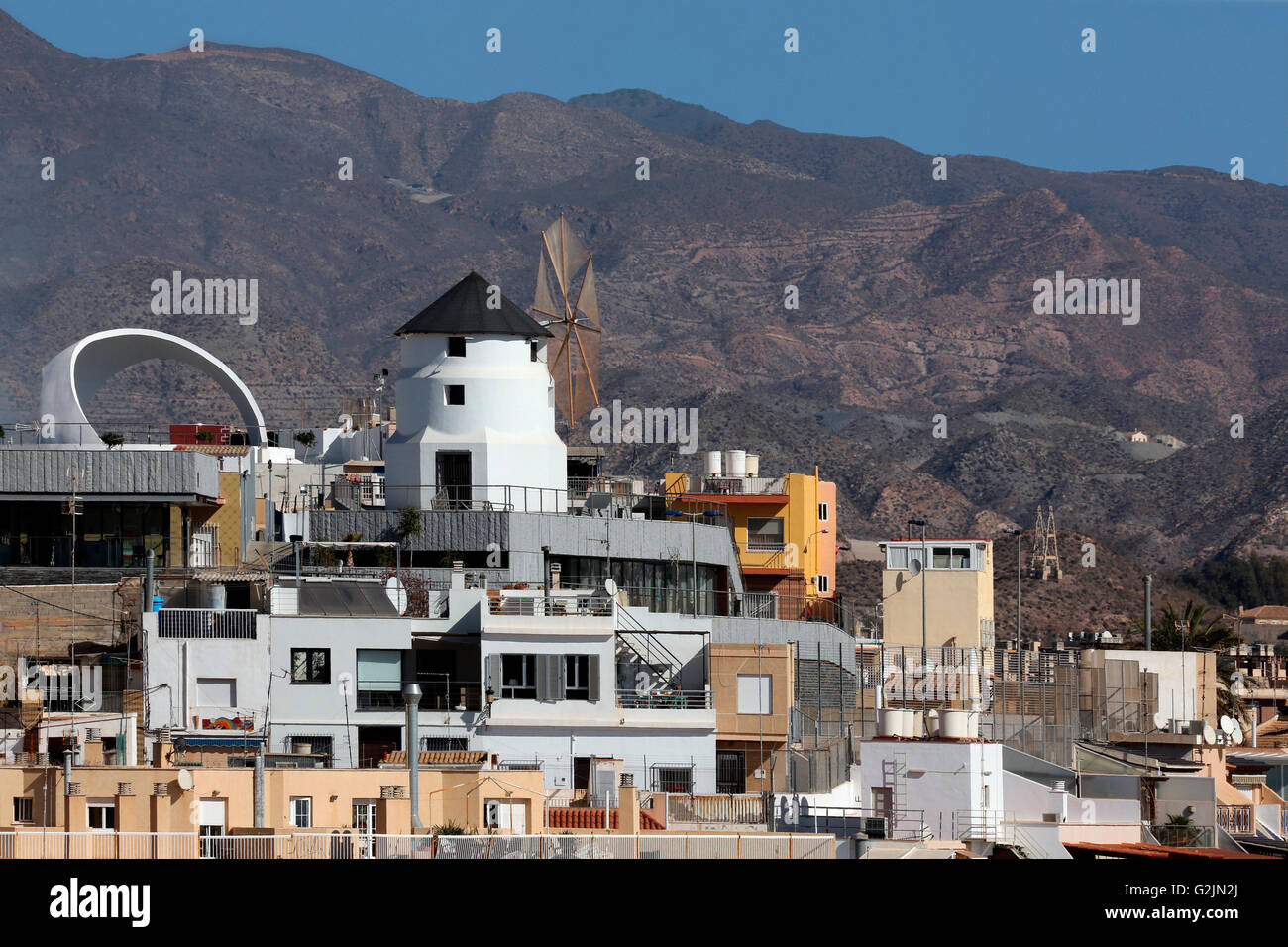 Rooftop windmill in the Mediterranean port of Aguilas on the Costa Calida in Murcia in southeastern Spain Stock Photo