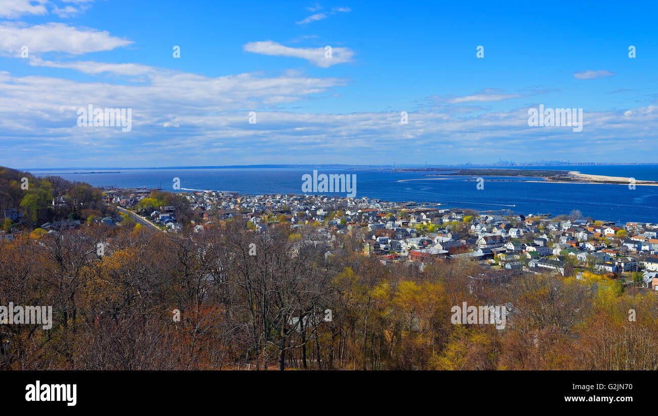 Houses and Atlantic Ocean shore at Sandy Hook with a view to NYC. View