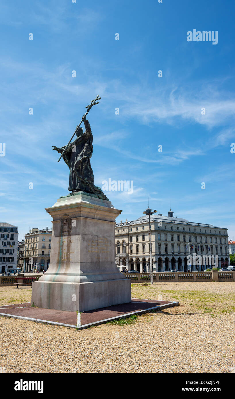 Statue of Cardinal Charles Martial Lavigerie in Place du Reduit with City Hall of Bayonne, called Mairie, in background. France. Stock Photo