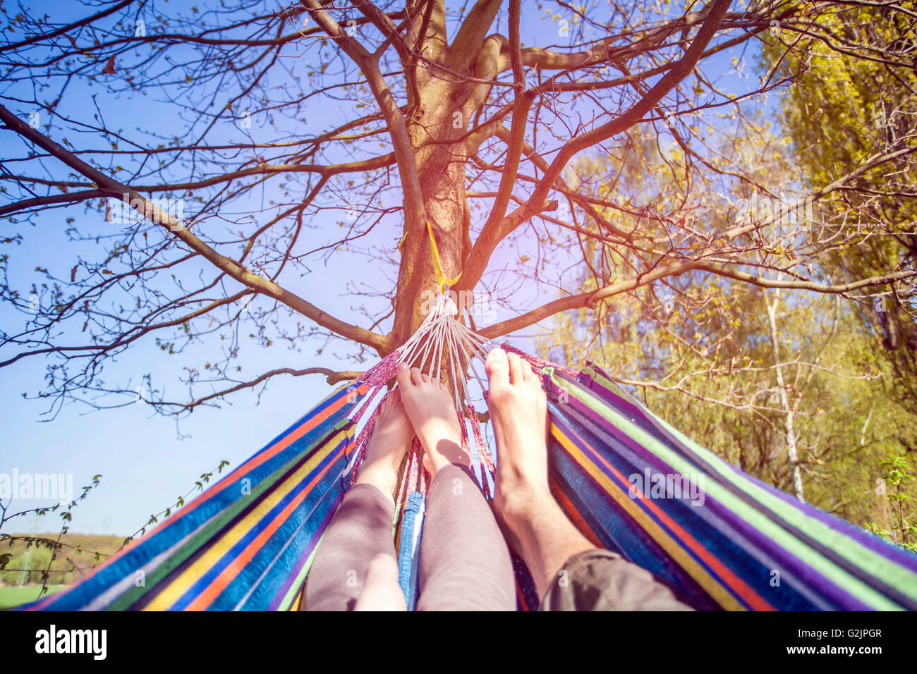 Resting legs in hammock Stock Photo