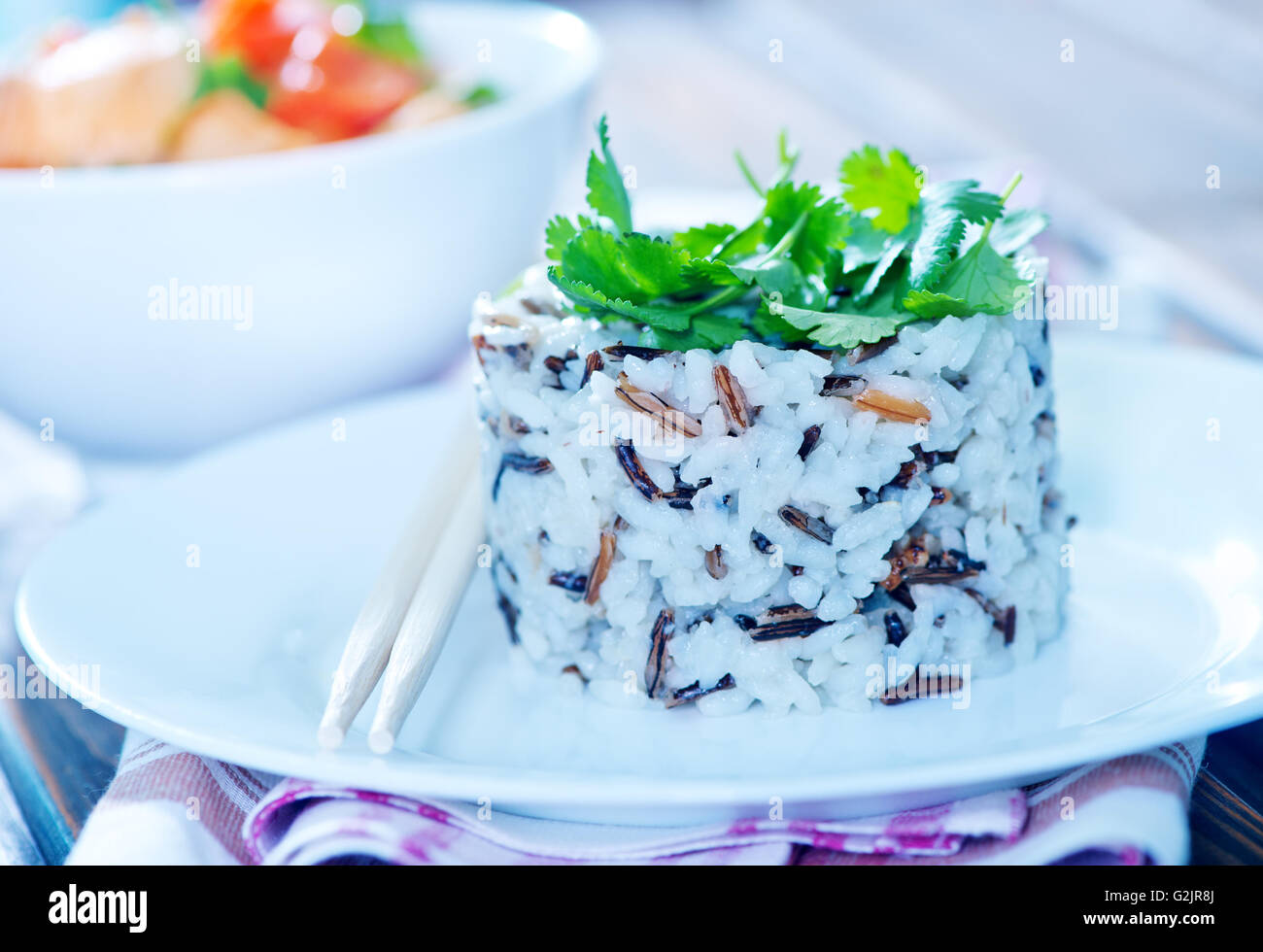 boiled rice on plate and on a table Stock Photo - Alamy