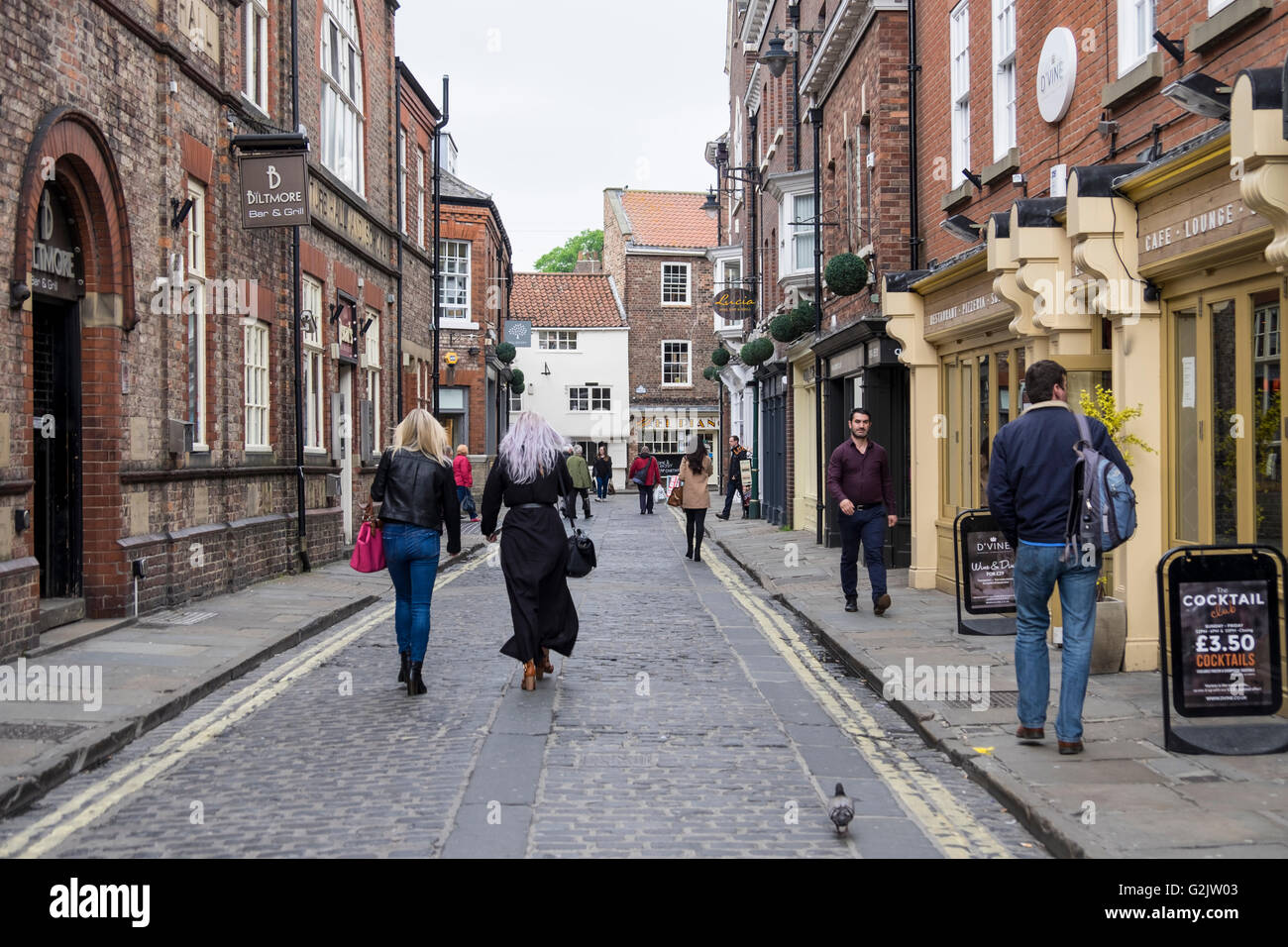 Two women strolling through the old streets of York Stock Photo