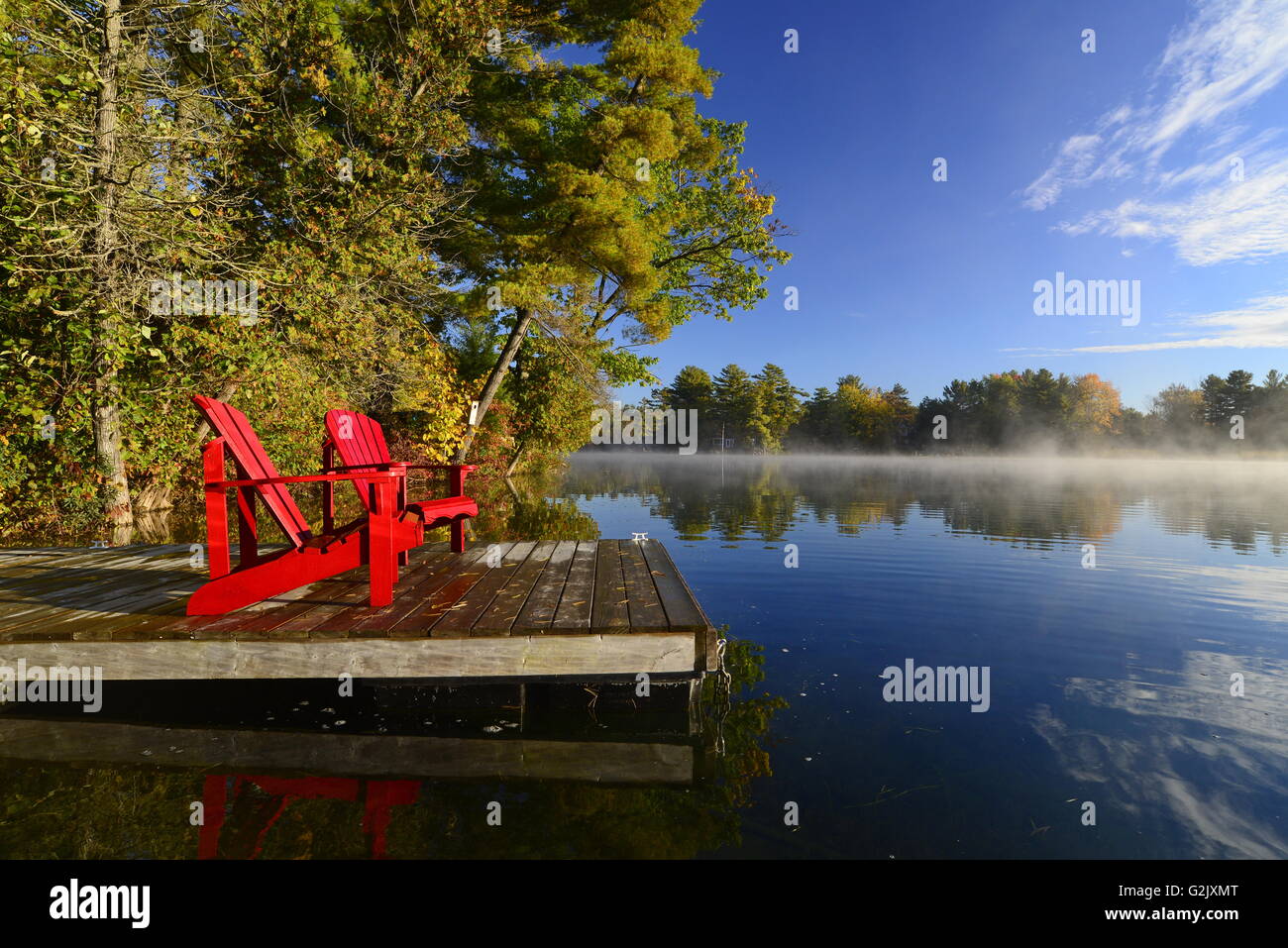 Muskoka Chair and dock, Severn River, Muskoka, Ont., Canada Stock Photo
