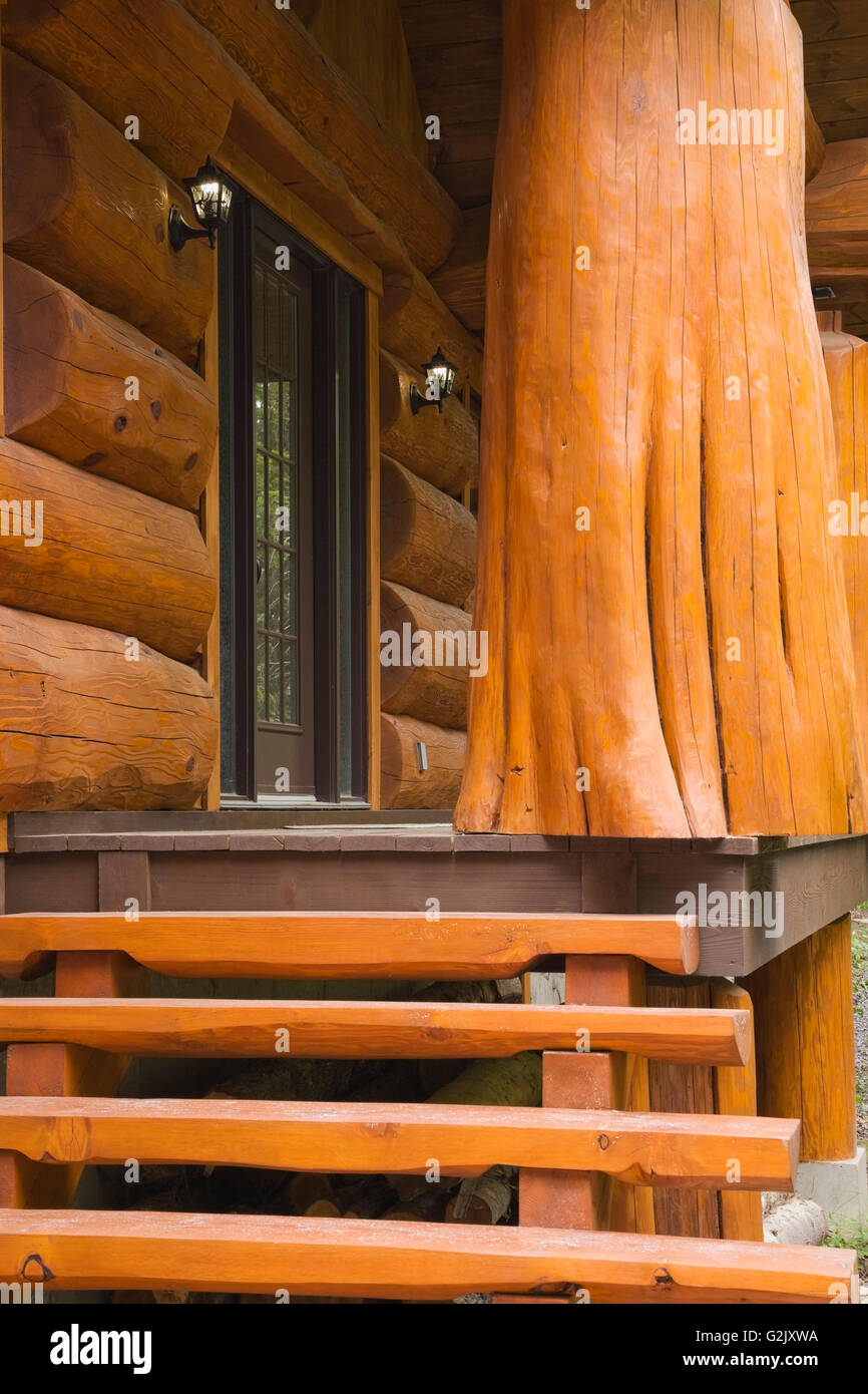 Handcrafted Red Cedar Log Home Facade With Steps And Veranda In