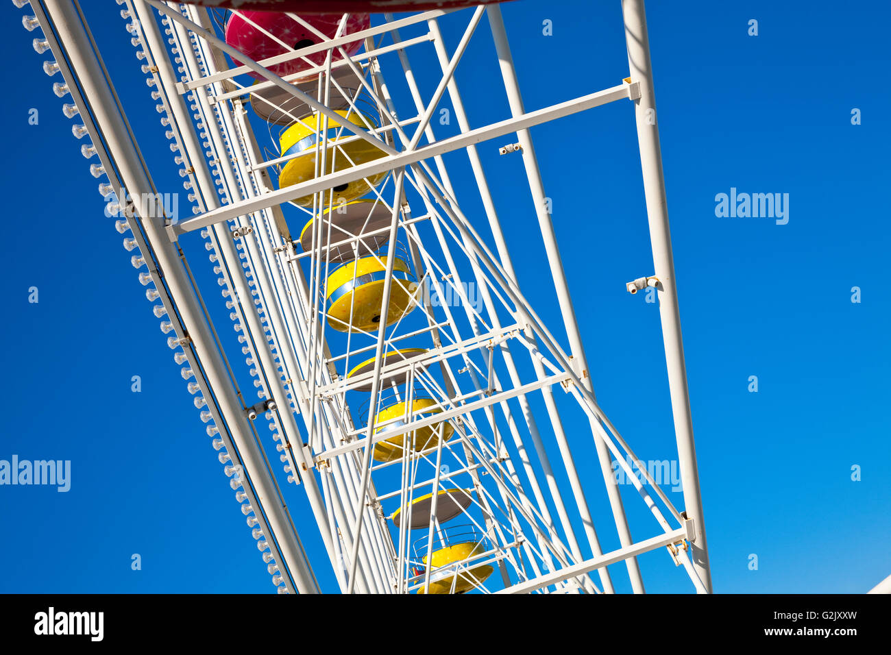 Ferris wheel sometimes called a big wheel, observation wheel, or, in the case of the very tallest examples, giant wheel Stock Photo