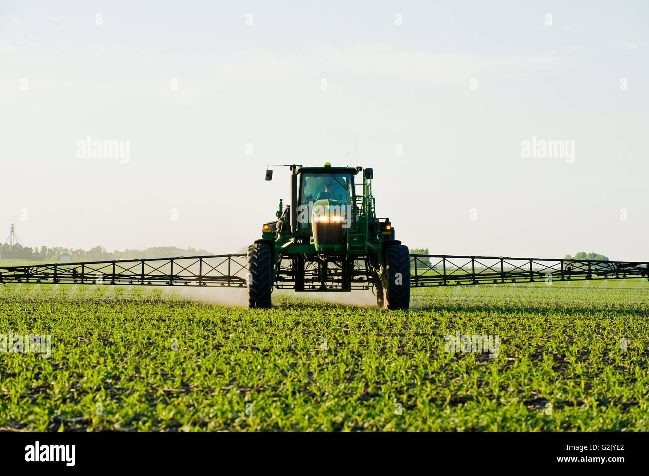 a high clearance sprayer make a chemical application herbicide on early