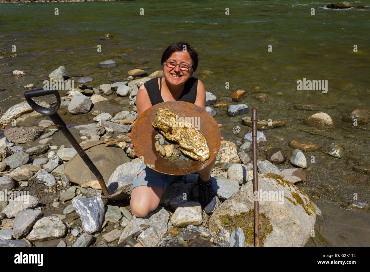 woman Panning for Alluvial Gold, using the traditional panning method