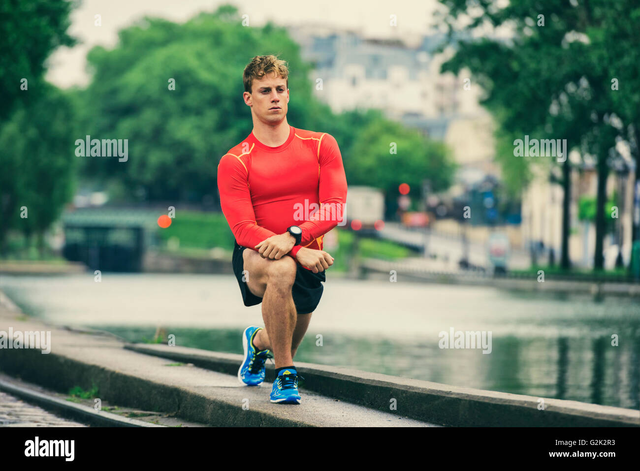 Young athletic man stretching outside Stock Photo