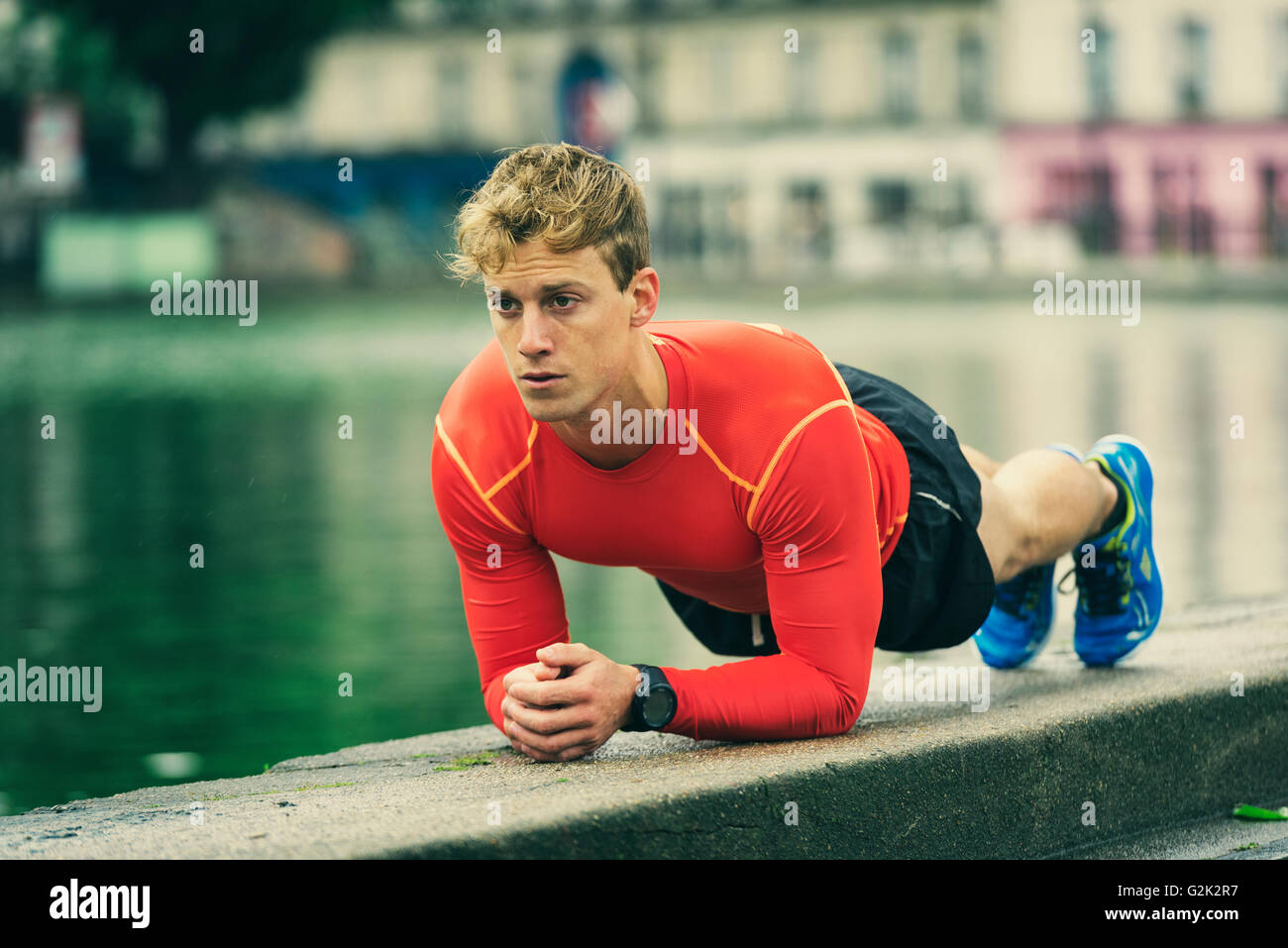 Crossfit young man planking exercising outside Stock Photo