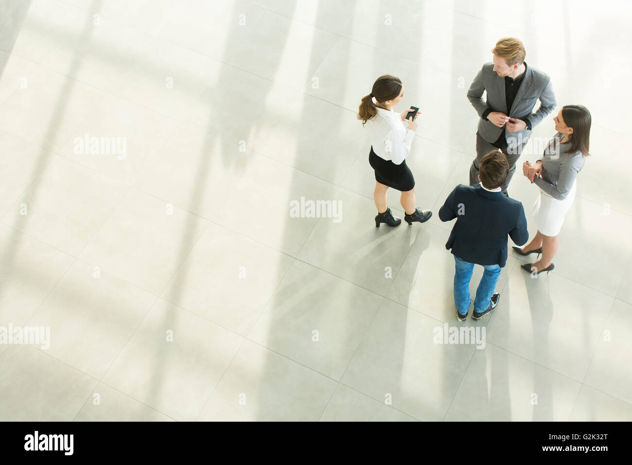 Group of young peopple in the modern office, viewed from above Stock Photo