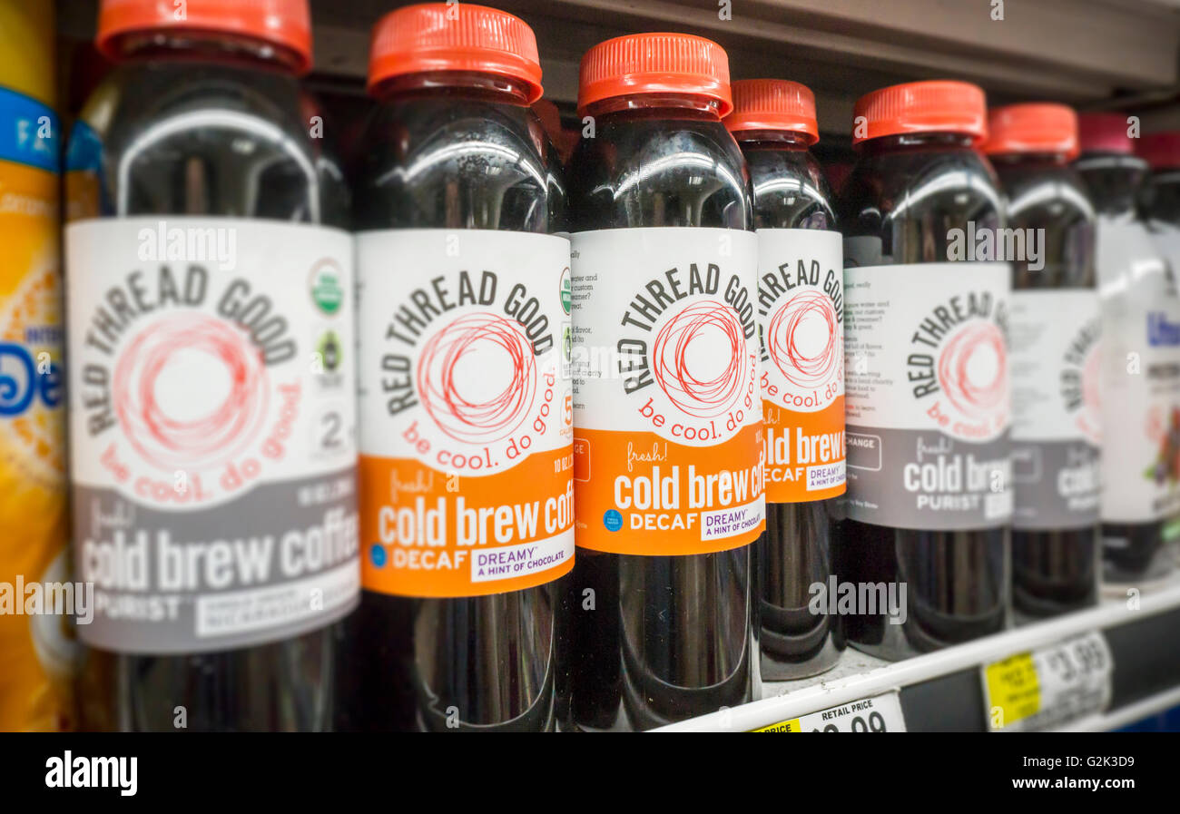 Bottles of Read Thread Good brand organic ready-to-drink coffee in a supermarket in New York on Wednesday, May 25, 2016. Coffee makers are throwing their weight into canned and bottled coffee, both cold brew and traditional in hopes that consumers will pick up on the fad. Ready-to-drink coffee sales in the U.S. have grown in the double digits in the last five years. (© Richard B. Levine) Stock Photo