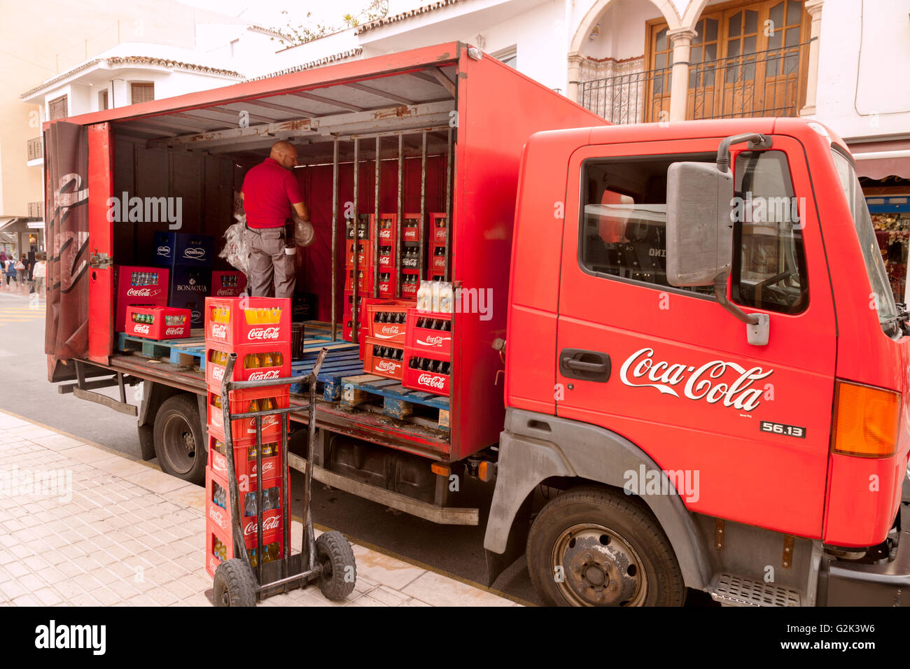 Coca Cola delivery van and staff unloading Cola bottles, Gibraltar Europe Stock Photo