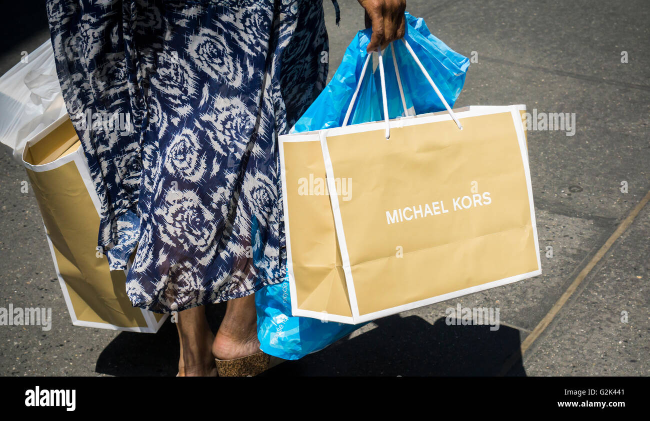 A woman in New York with her Michael Kors purchases on Friday, May 27, 2016. (© Richard B. Levine) Stock Photo