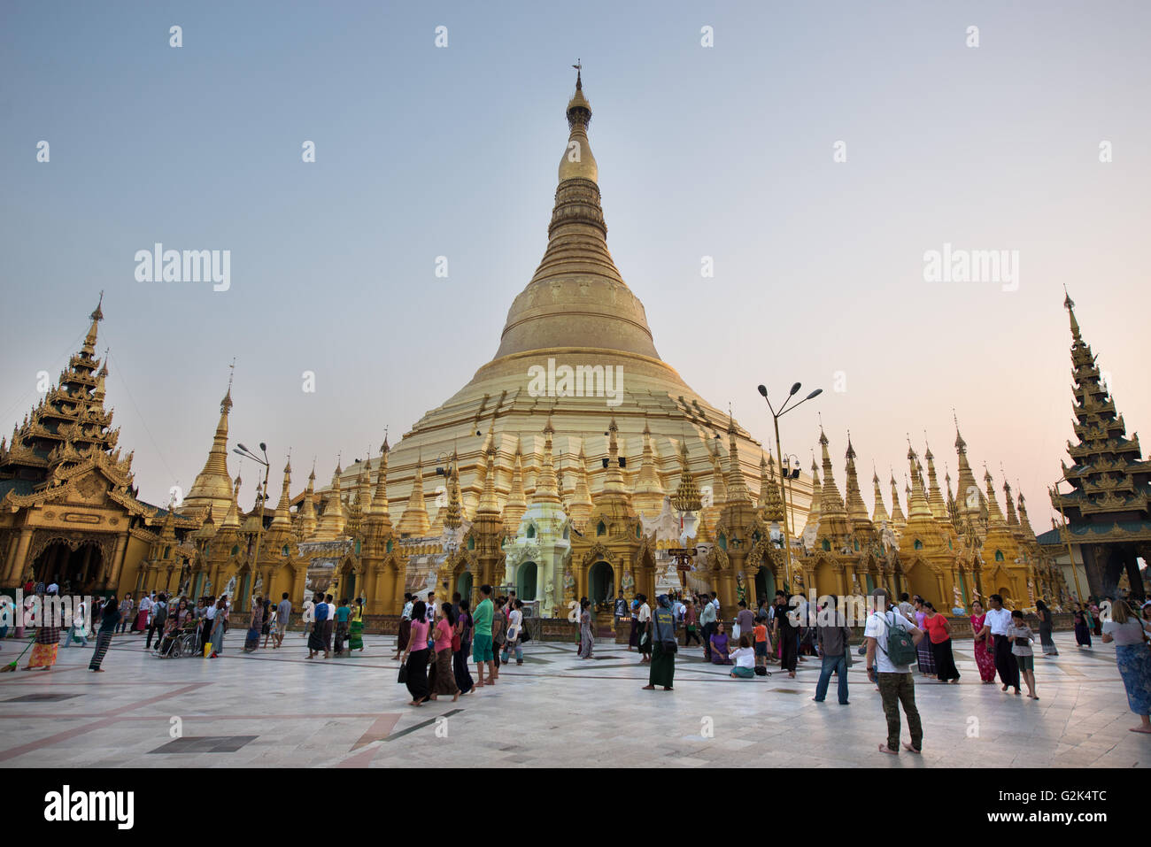 Believers and tourists at Shwedagon Paya, Yangon, Myanmar Stock Photo