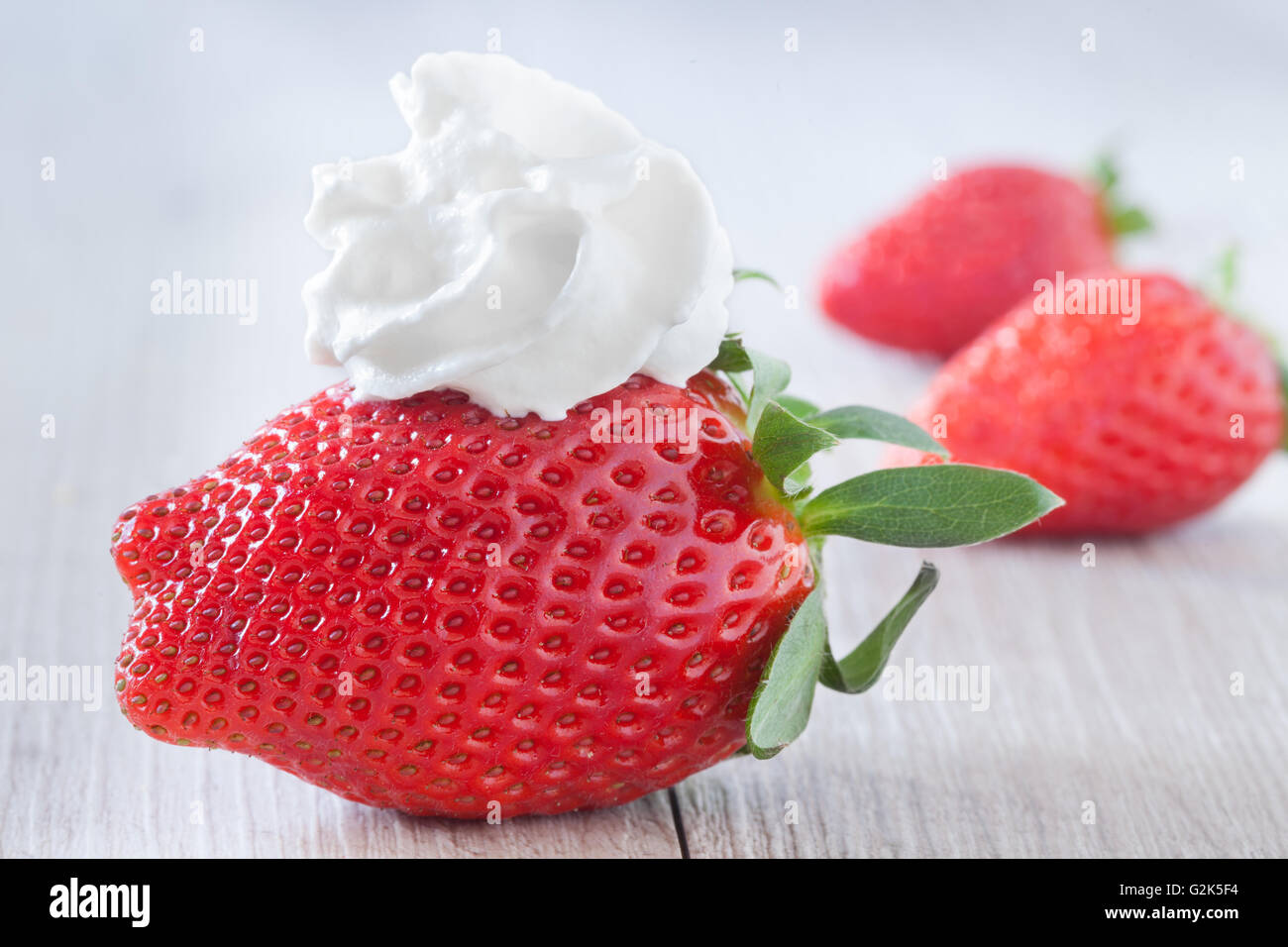Strawberry And Whipped Cream Stock Photo Alamy