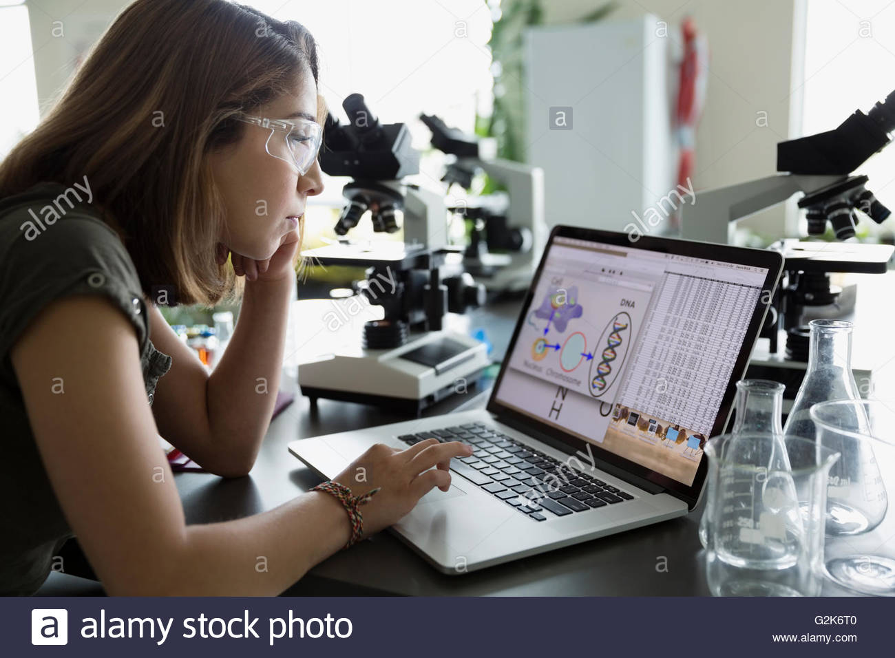 College student using laptop in science laboratory Stock Photo