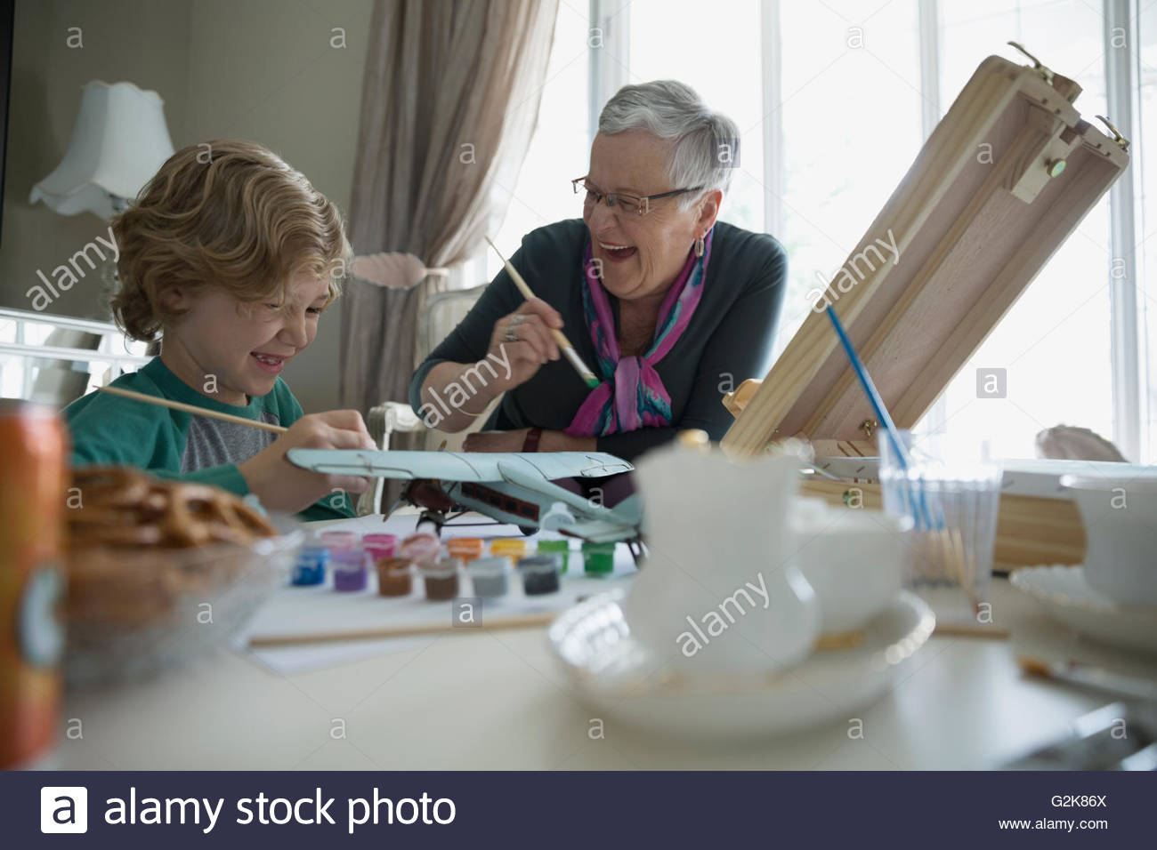 Grandmother and grandson painting Stock Photo